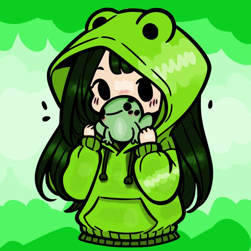 a girl holding a froggy hoodie
