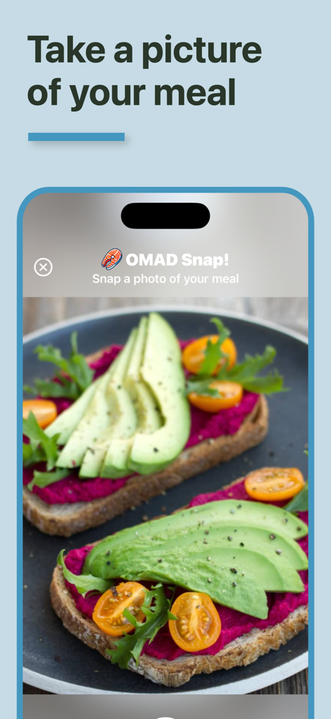 A smartphone interface showing the OMAD Snap app taking a picture of a healthy avocado toast meal for a visual fasting journal.
