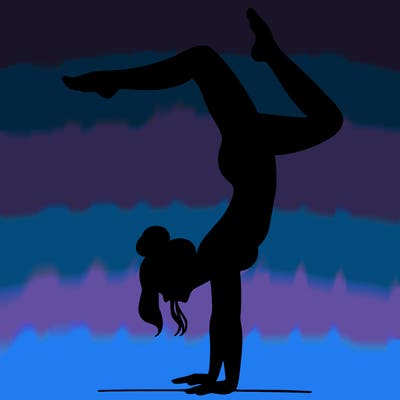 a woman doing a handstand