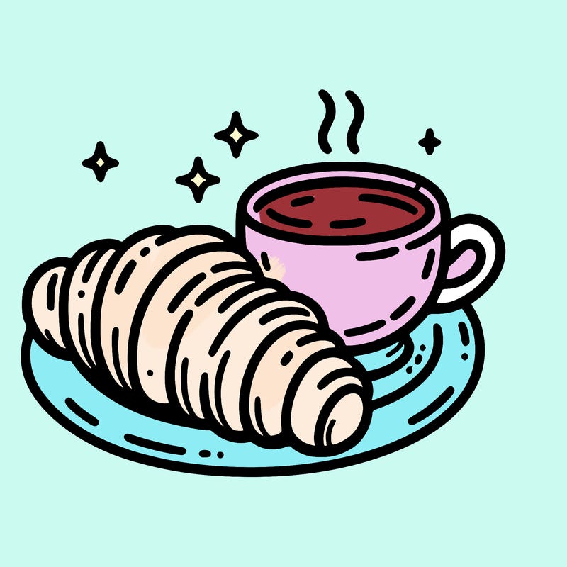 a croissant and a hot coffee placed on a plate