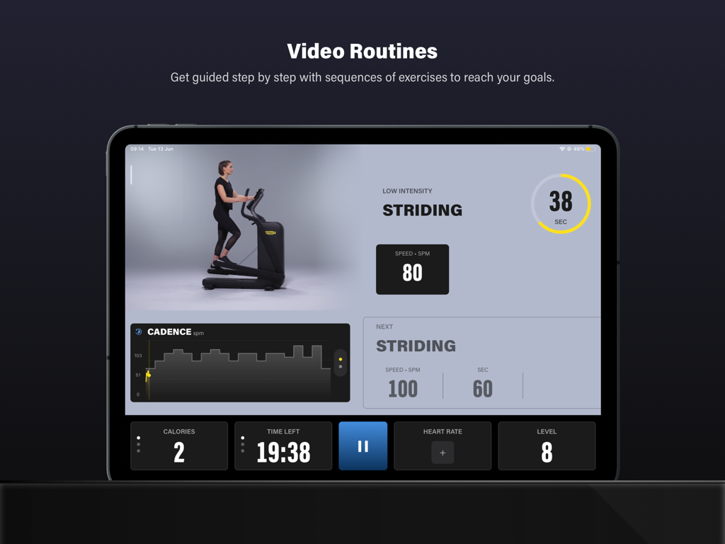Technogym Live - Interface of the Technogym Live app on an iPad showing a guided video routine for an elliptical trainer with metrics like cadence and time remaining