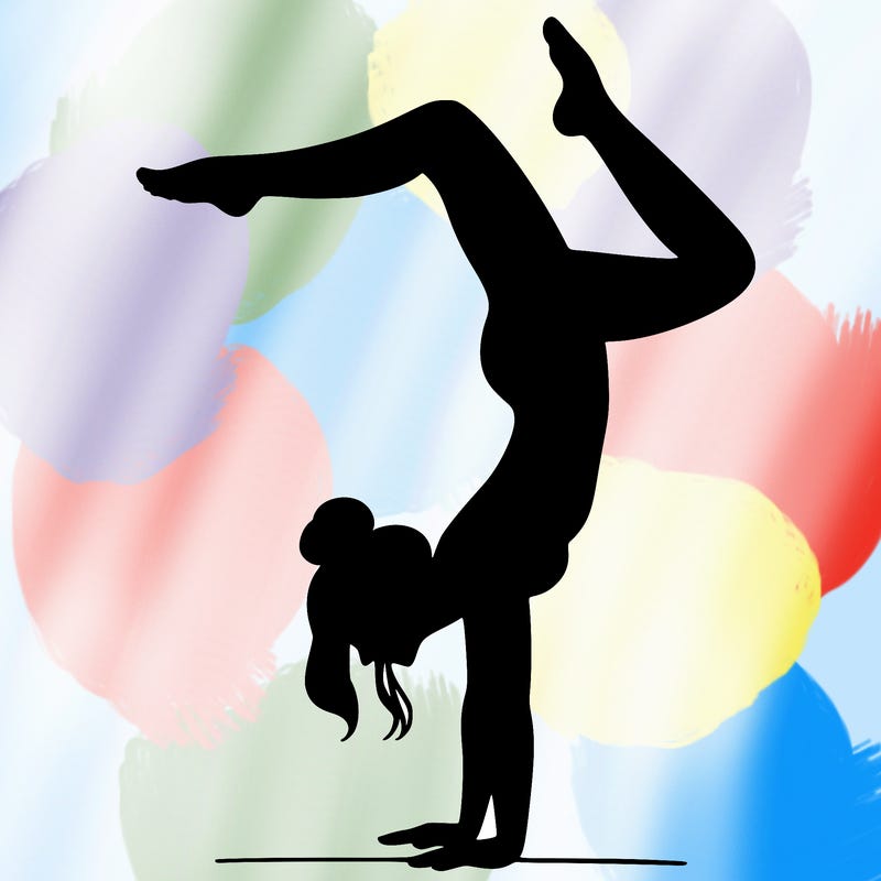 a woman doing a handstand