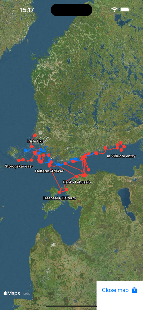 Satellite map view displaying red and blue GPS routes and waypoints for navigation planning