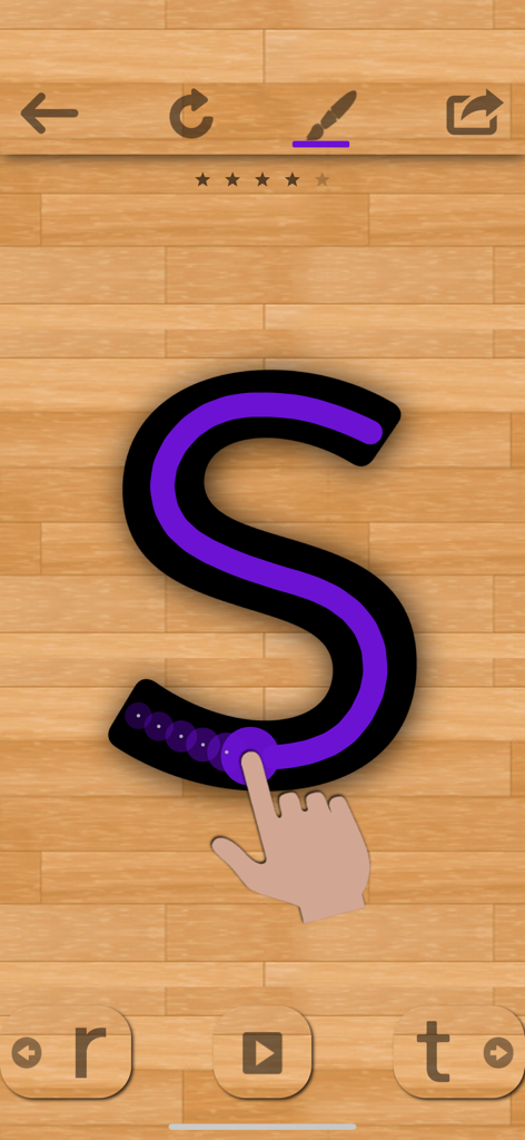 English 101 - Learn to Write - Una mano trazando la letra S morada en la interfaz de la aplicación educativa English 101