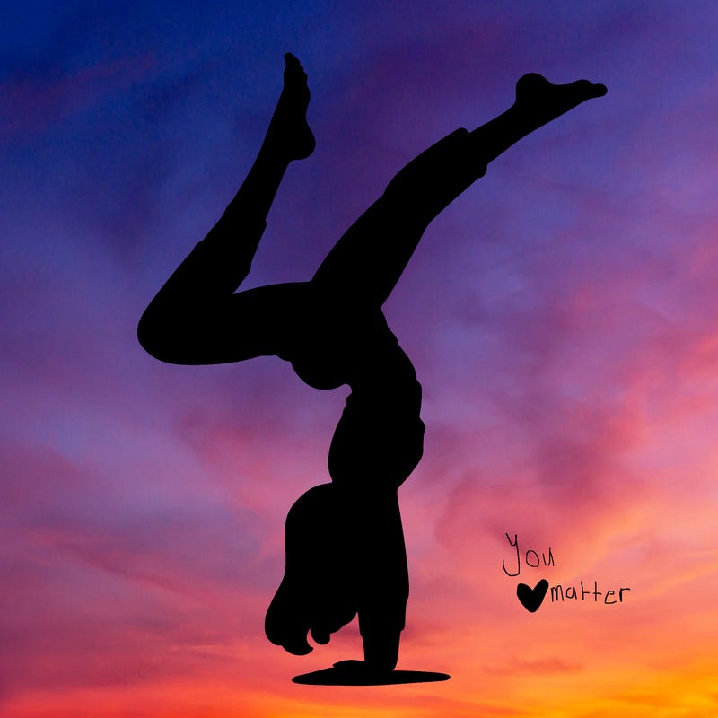 'woman doing a handstand