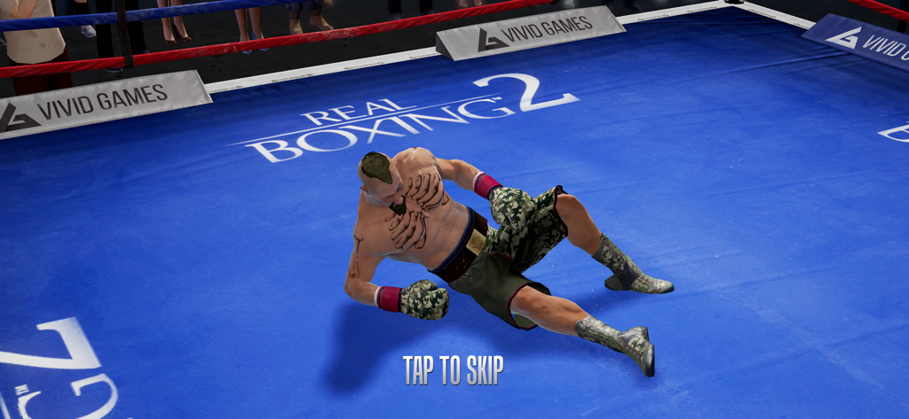 A boxer knocked down on the blue canvas of a boxing ring in Real Boxing 2