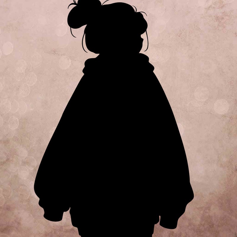realistic girl with a oversized sweatshirt on and a bun