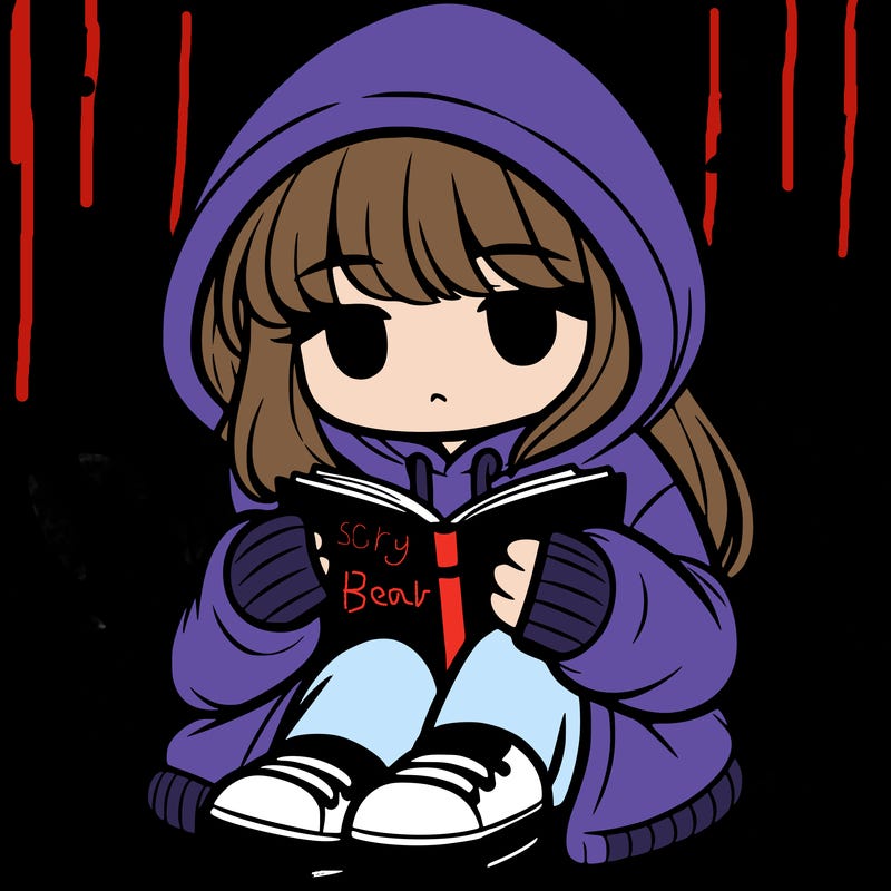 girl in oversized hoodie reading a book