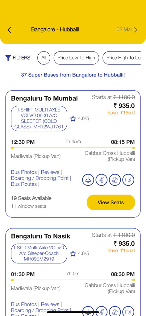 Vijayanand Travels - Vijayanand Travels app screen showing luxury bus booking options from Bengaluru to Mumbai with prices and timings.