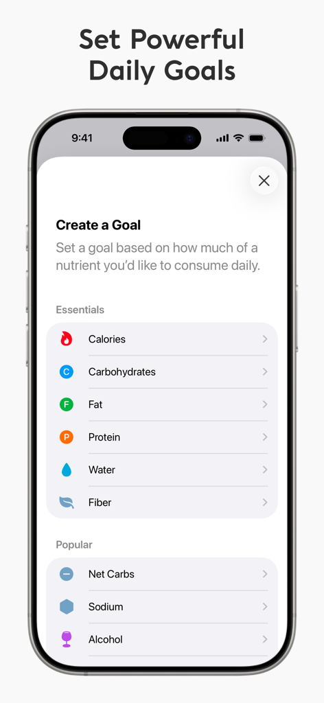 A smartphone screen showing the Foodnoms app interface for setting daily nutrition goals like calories, macros, and net carbs.