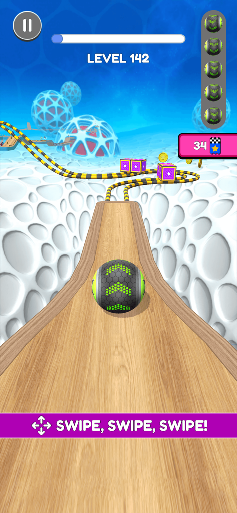 A black and green ball rolling on a wooden track in level 142 of the Going Balls mobile game
