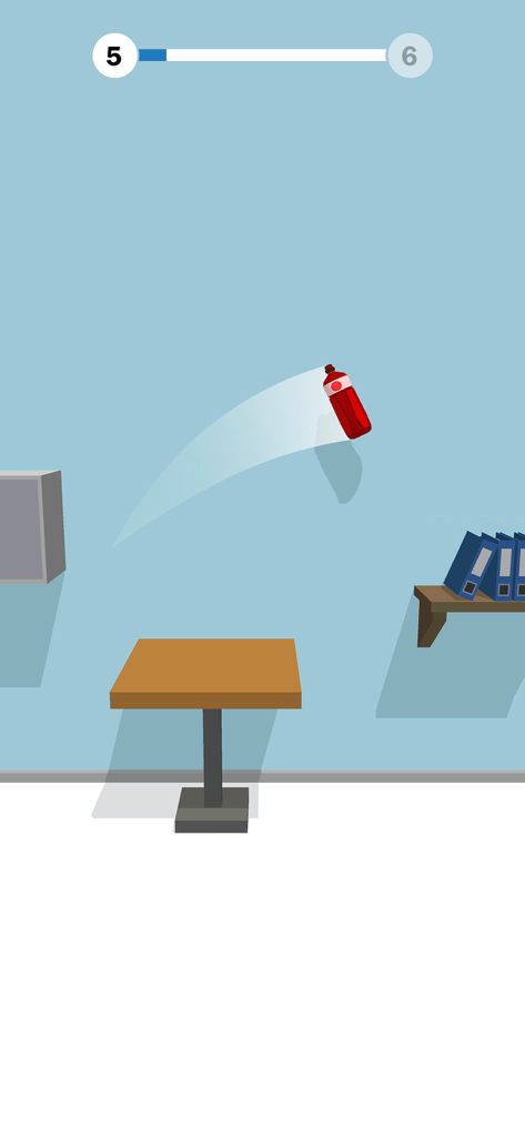 A red bottle flipping mid-air over a table in the Bottle Flip 3D game
