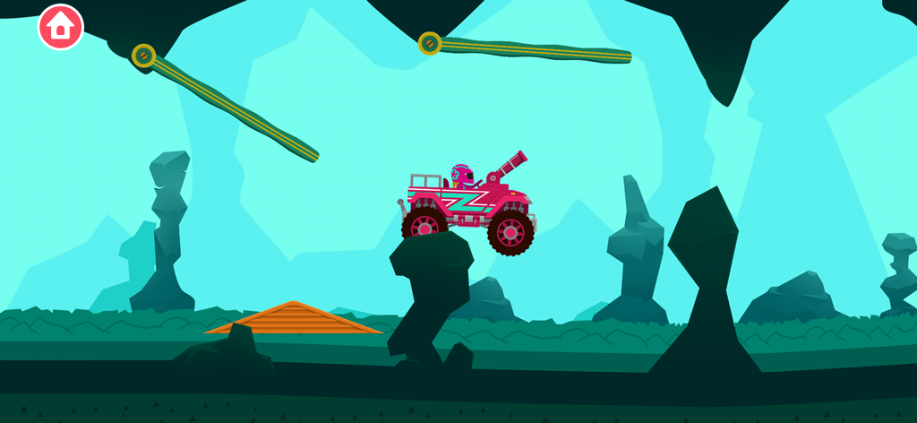 Un monster truck rose avec un canon faisant la course dans un niveau de grotte souterraine