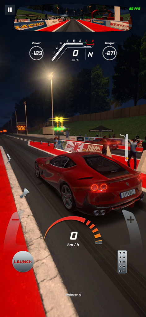 Project Xtreme - Un coche deportivo rojo en la línea de salida de una carrera de drag nocturna en Project Xtreme.