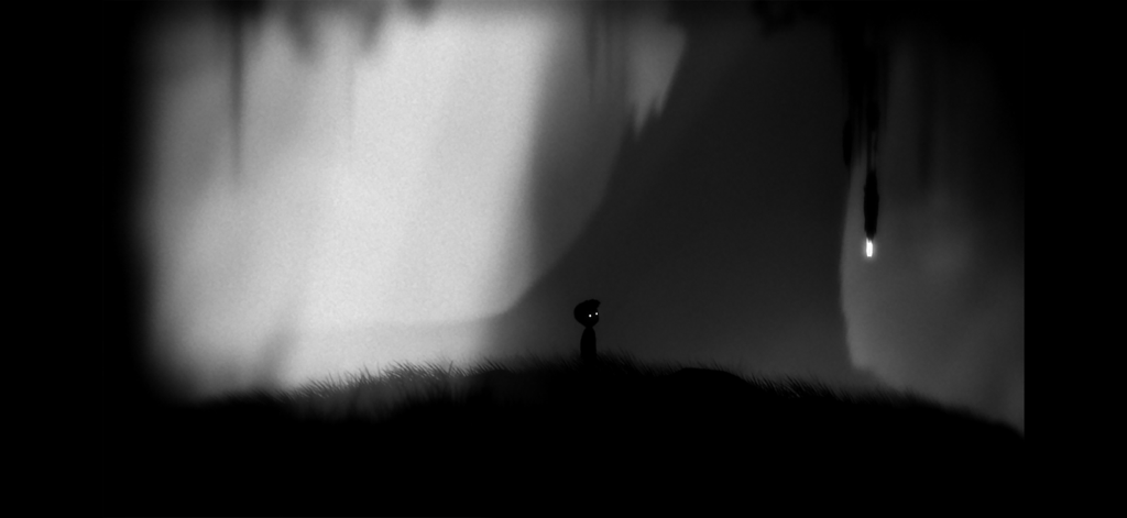Playdead's LIMBO - Silueta de un niño con ojos brillantes en el paisaje oscuro y brumoso de LIMBO de Playdead