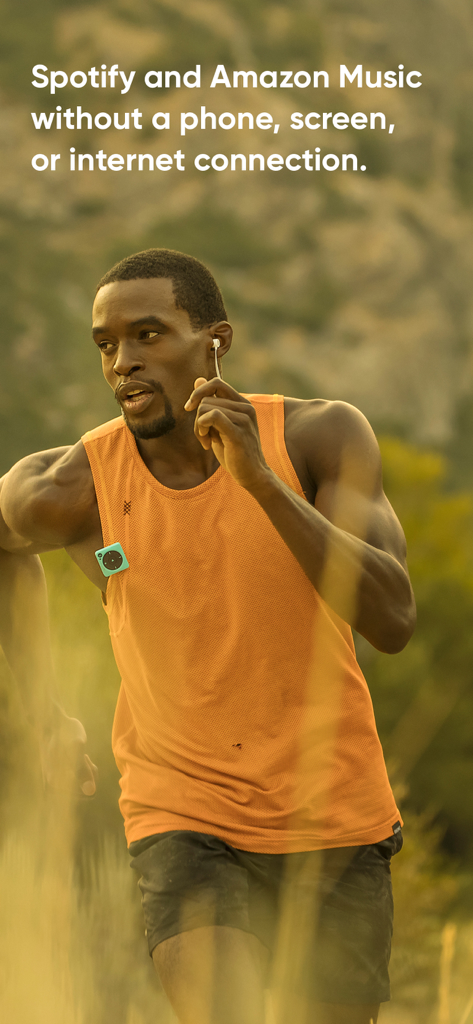 Mighty Audio - A man running outdoors with a small Mighty Audio player clipped to his shirt for phone-free music streaming