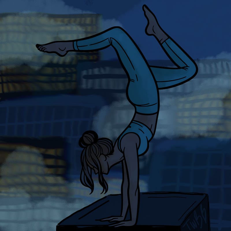 a woman doing a handstand