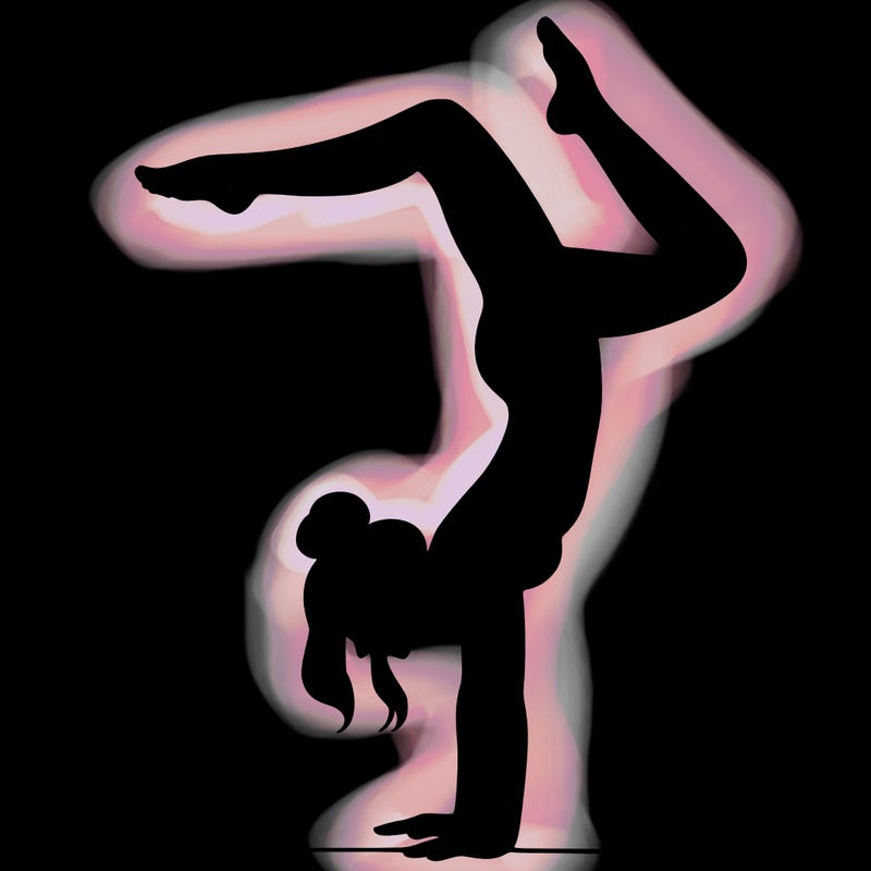 a woman doing a handstand