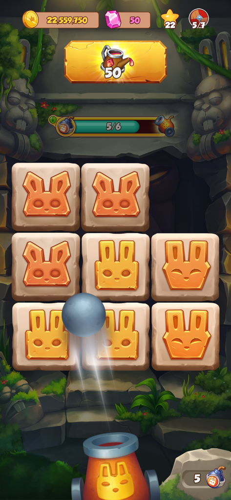 A cannon shooting at stone tiles with rabbit faces in a jungle ruins themed mini game.