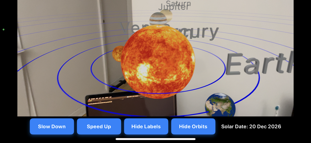 Augmented reality simulation of the solar system showing the Sun and orbiting planets with educational controls