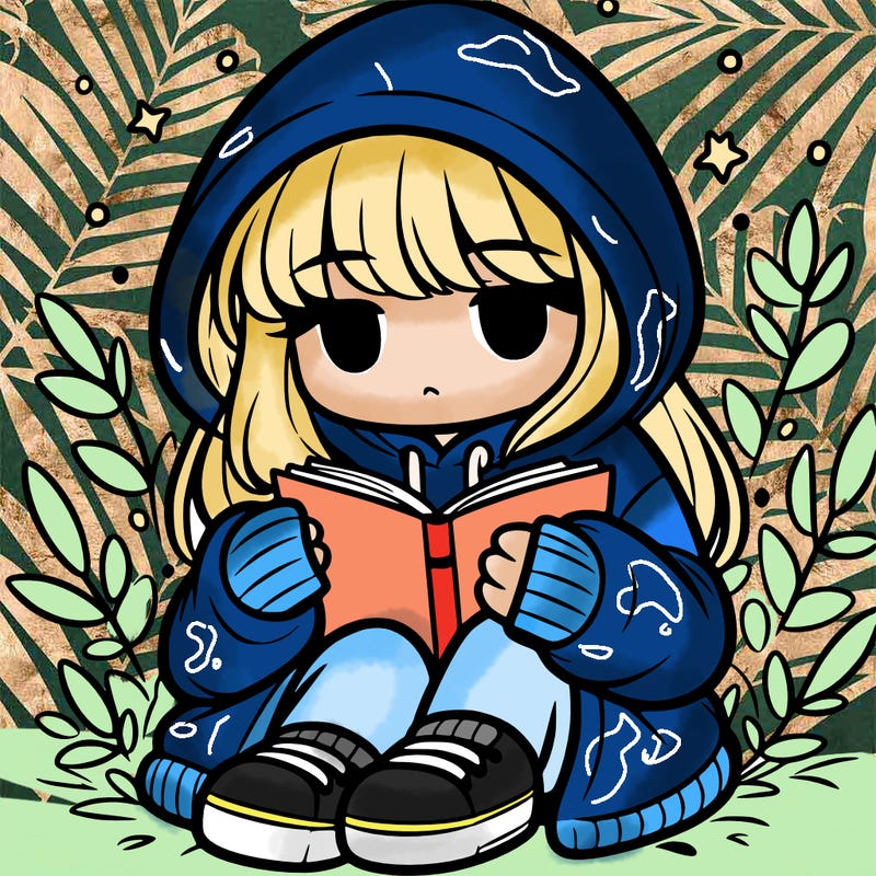 girl in oversized hoodie reading a book