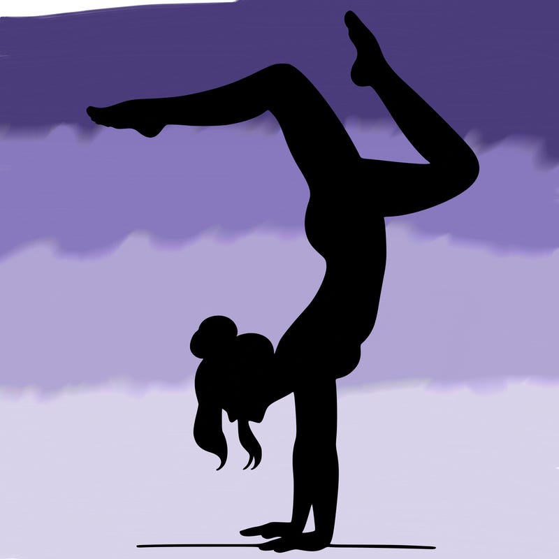 a woman doing a handstand