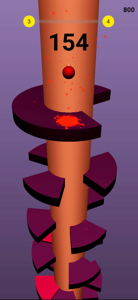 A red ball bouncing on a dark purple spiral platform in the Helix Bouncy Ball game