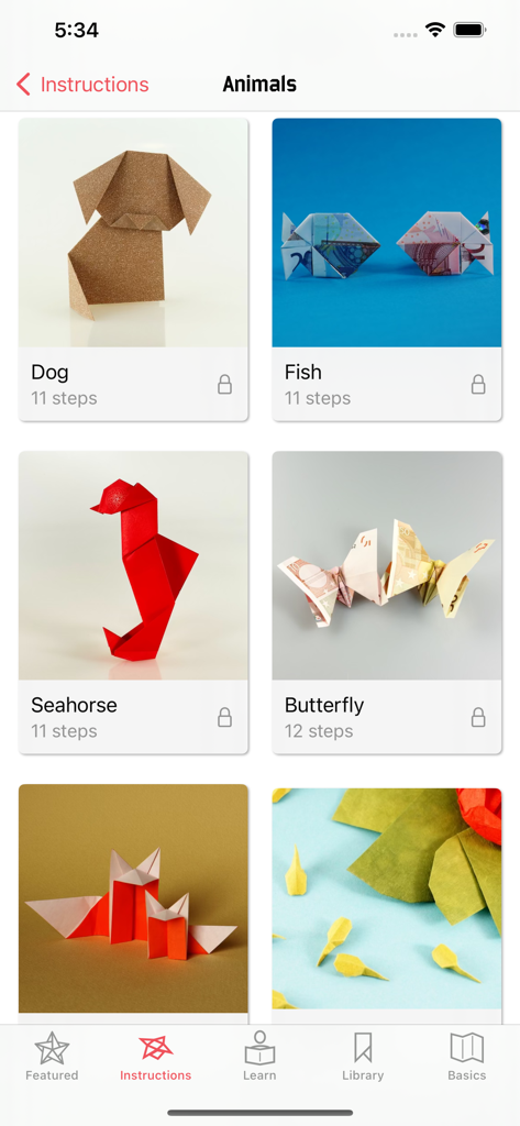 In-app view of Origami - Fold and Learn showing a gallery of animal models like a dog, fish, and butterfly.