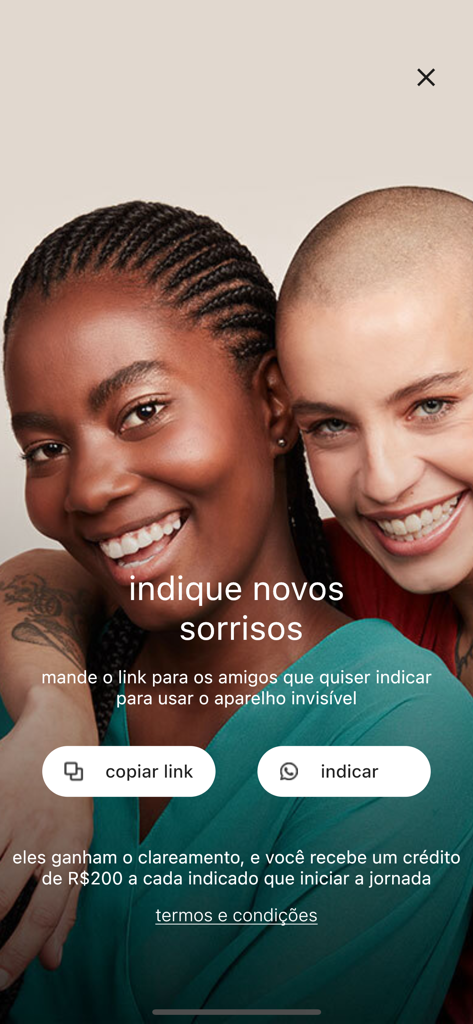 SouSmile - SouSmile app referral screen featuring two smiling women and options to share a link for rewards