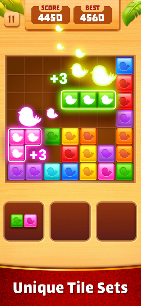 Match Tiles: Block Puzzle Game - Capture d'écran du gameplay de Match Tiles Block Puzzle montrant des blocs d'oiseaux colorés et des animations lumineuses sur une grille