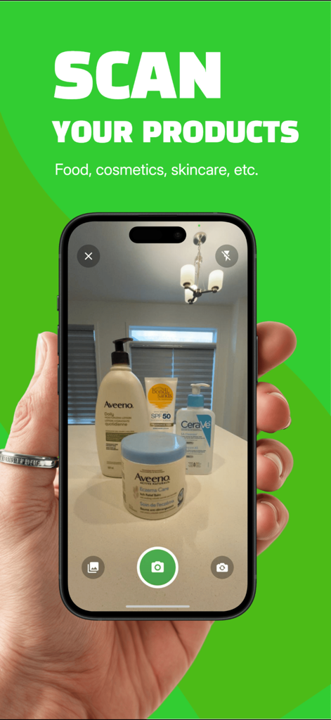 Reveal it - Product Scanner - A hand holding a smartphone using the Reveal it app to scan skincare and cosmetic products on a counter