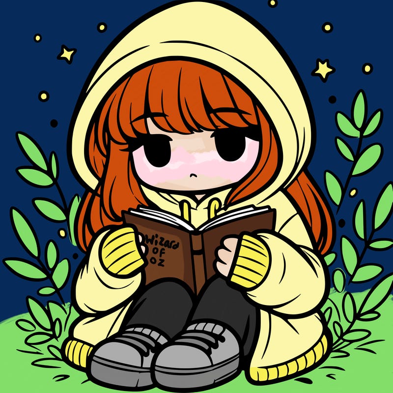 girl in oversized hoodie reading a book