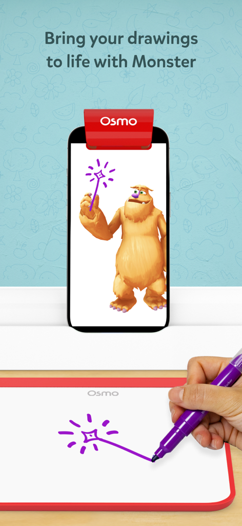 A hand draws a purple magic wand on a physical board which then appears on an iPhone screen with the character Mo