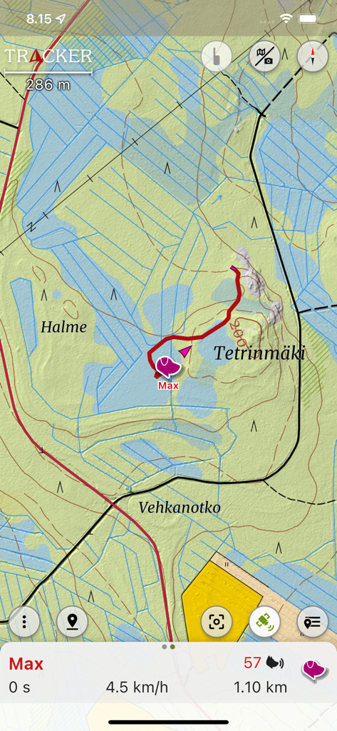 Real-time dog tracking interface showing a trail on a topographic map within the Tracker app