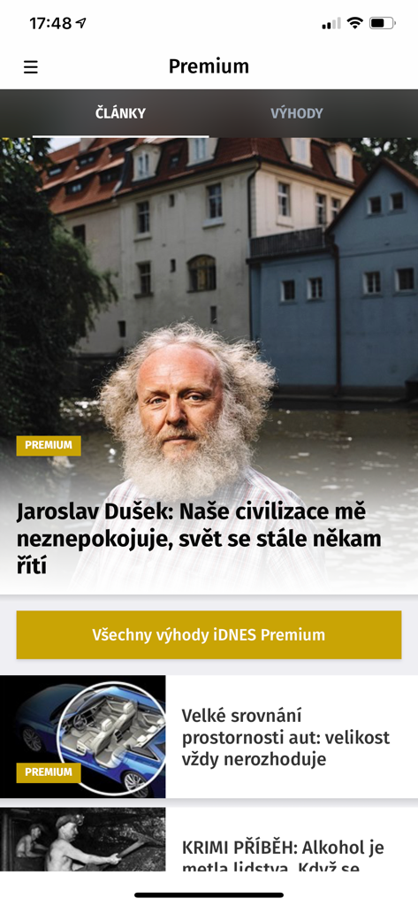 Screenshot of the iDNES.cz premium news section on a mobile device showing exclusive articles and cultural interviews in Czech.