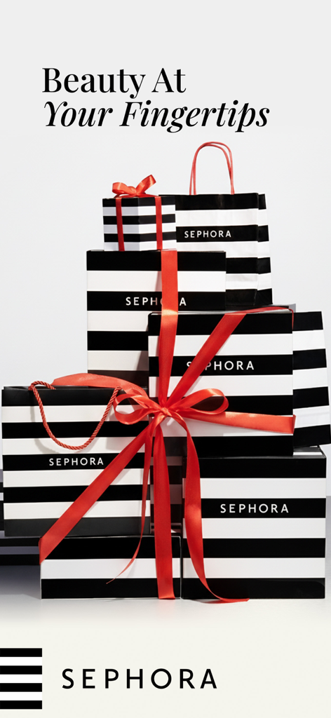 Sephora UAE: Beauty & Makeup - A stack of Sephora branded shopping bags and gift boxes tied with a red ribbon.
