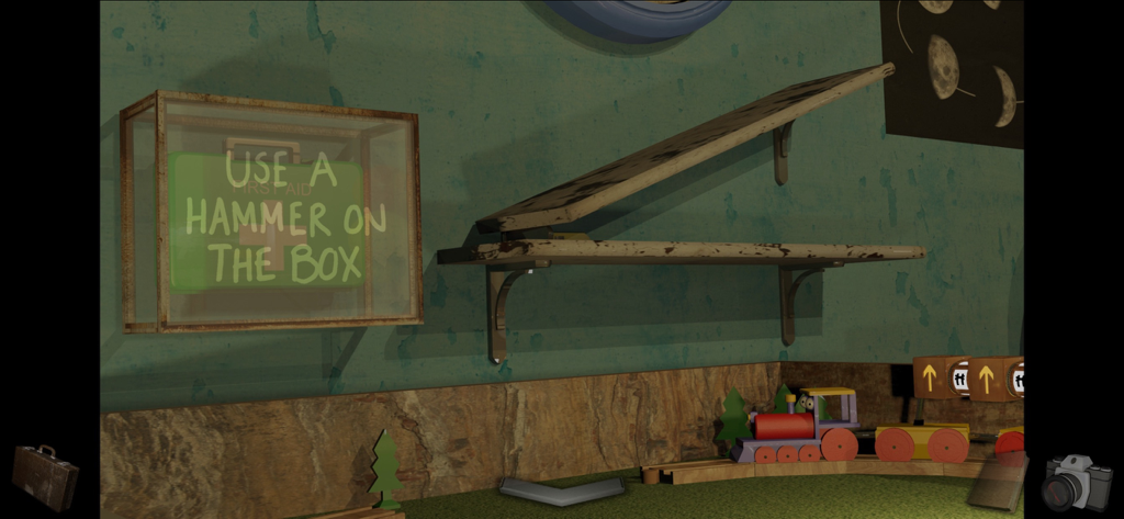 A Short Tale - A first-person point and click puzzle in A Short Tale showing a toy train and a first aid kit box with instructions to use a hammer.