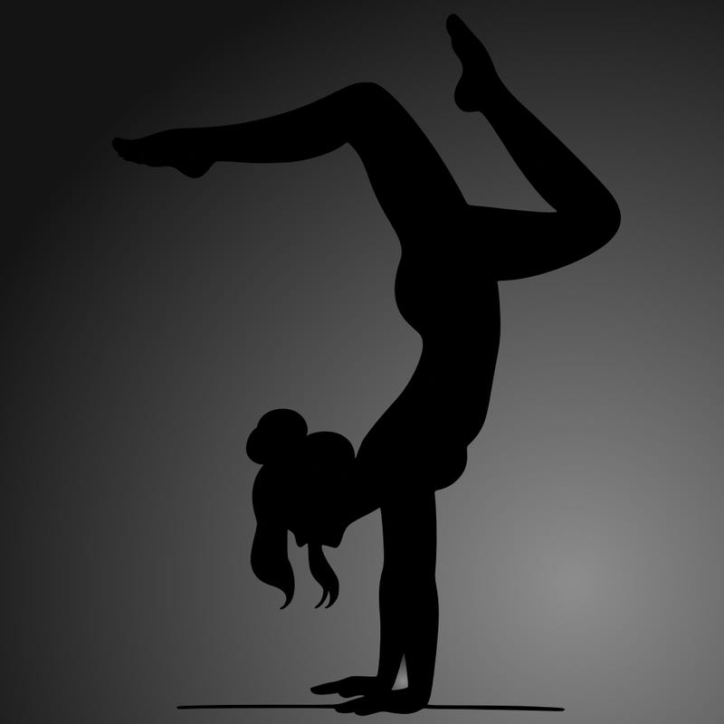 a woman doing a handstand