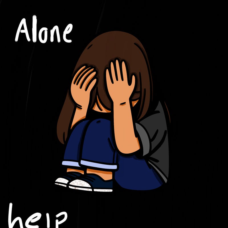 girl sitting down covering her head