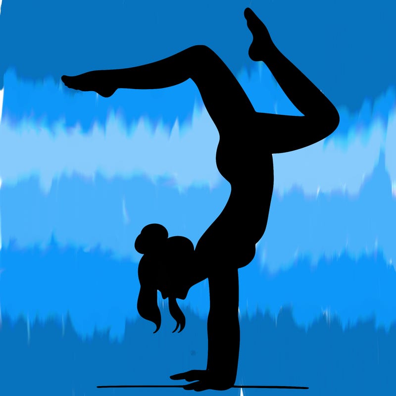 a woman doing a handstand