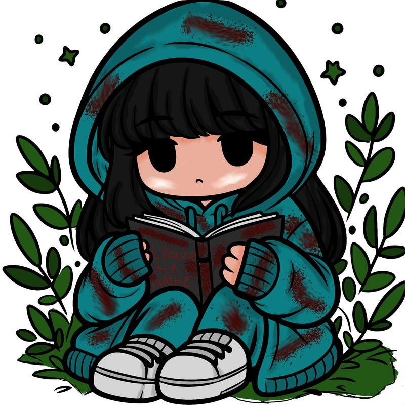 girl in oversized hoodie reading a book