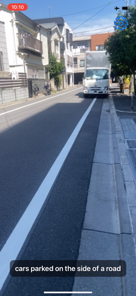 Talking Cam - Talking Cam interface describing a street scene with a parked truck using AI