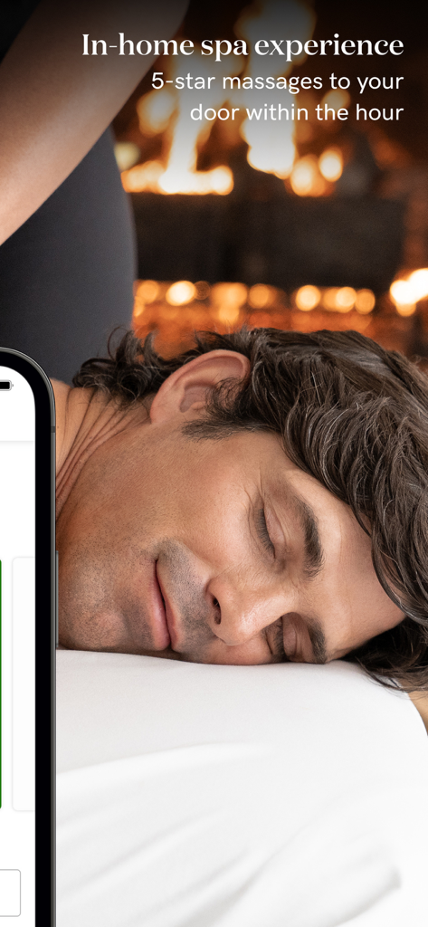 A man receiving a relaxing professional massage at home with a fireplace in the background
