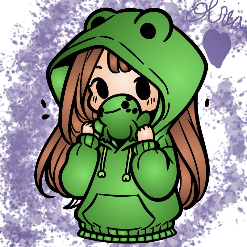 a girl holding a froggy hoodie