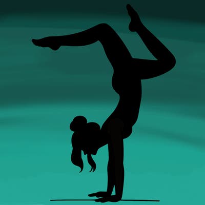a woman doing a handstand