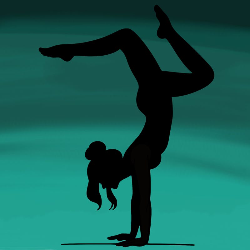 a woman doing a handstand
