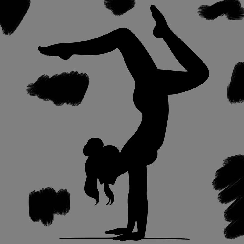 a woman doing a handstand