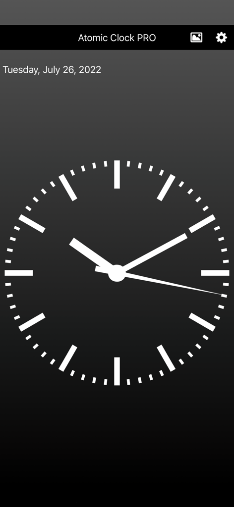 Atomic Clock PRO - Atomic Clock PRO app showing a minimalist white analog clock face on a dark background