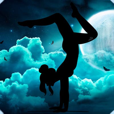 a woman doing a handstand