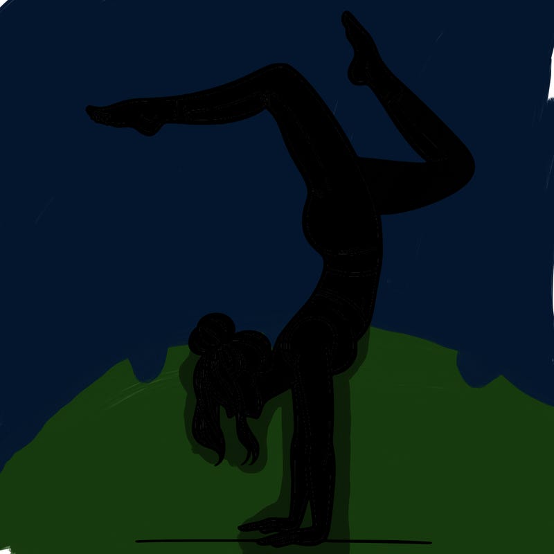 a woman doing a handstand